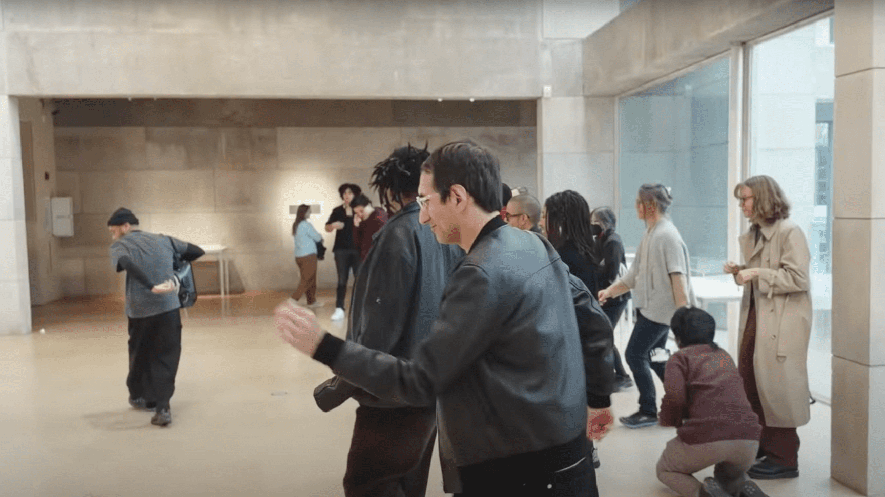 A group of people dancing in Jeremy Toussaint-Baptiste's performance of "Y’all Don’t Wanna Hear Me (You Just Wanna Dance)"